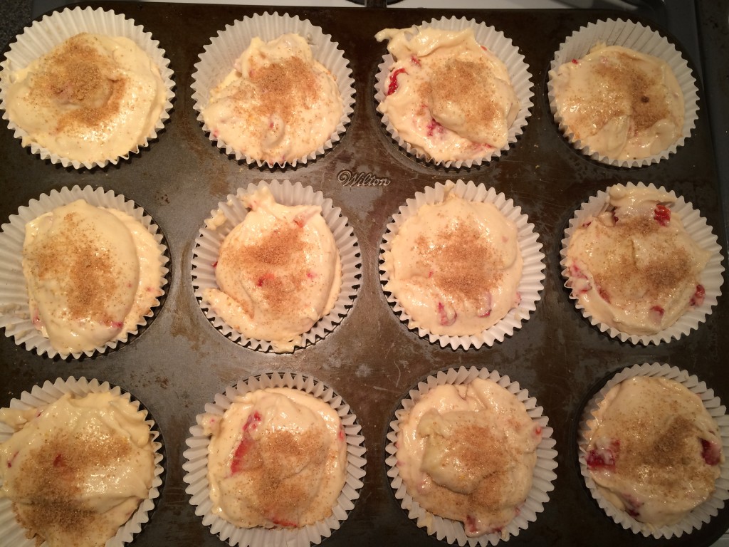 STEP FOUR: Sprinkle cinnamon and brown sugar on top of each muffin before baking